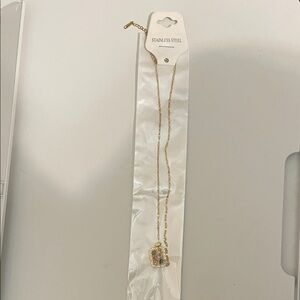 Stainless steel gold fashion jewelry necklace. New in package.